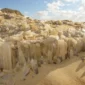 Travelers exploring Crystal Mountain in Egypt’s Western Desert, surrounded by glittering quartz crystals reflecting the golden desert light.