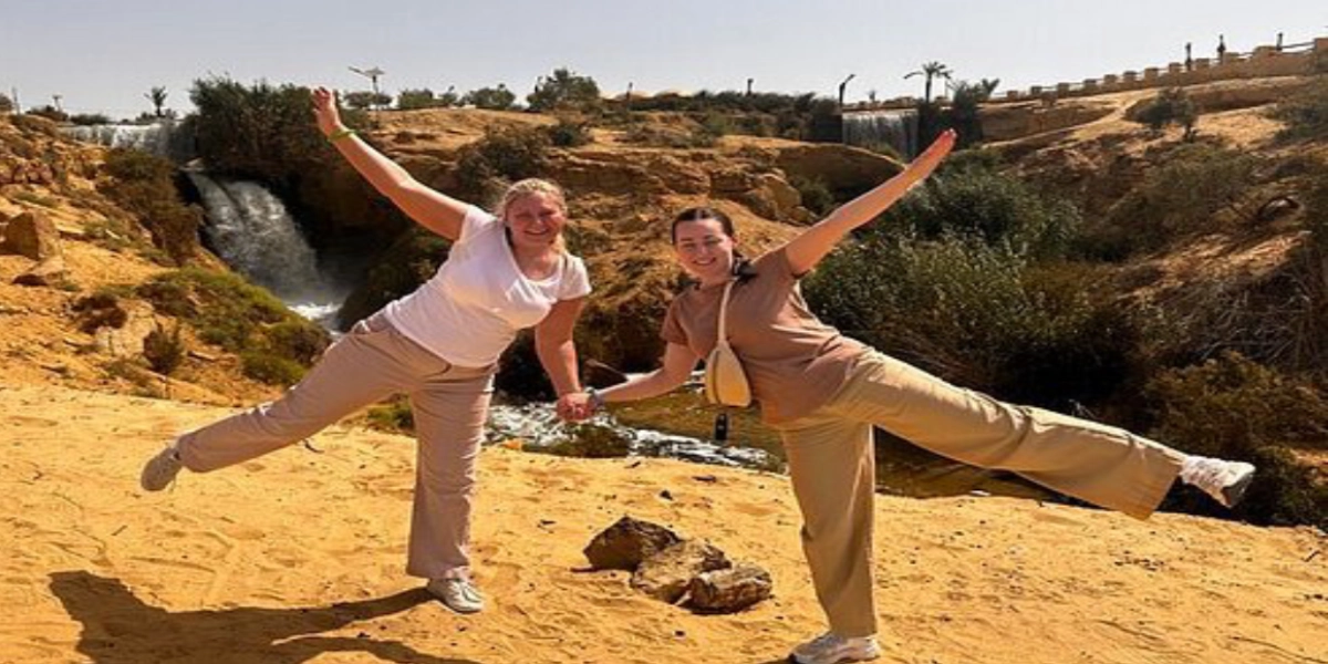 Family exploring Fayoum’s natural sites including Wadi El Rayan waterfalls, Magic Lake dunes, and Tunis Village pottery workshops during a desert tour.