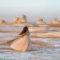 White Desert chalk formations at sunset in Egypt, with travelers exploring the unique landscapes on a Heart Egypt Tours adventure.